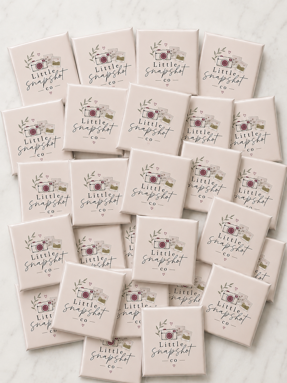 Little Snapshot Co branded logo magnets showcasing custom promotional magnets for business branding and marketing.